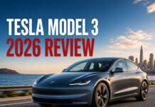 Tesla Model 3 2026 Review: Is It Still the Best EV? Tesla Model 3 2026 review featured image showing electric car driving on coastal road
